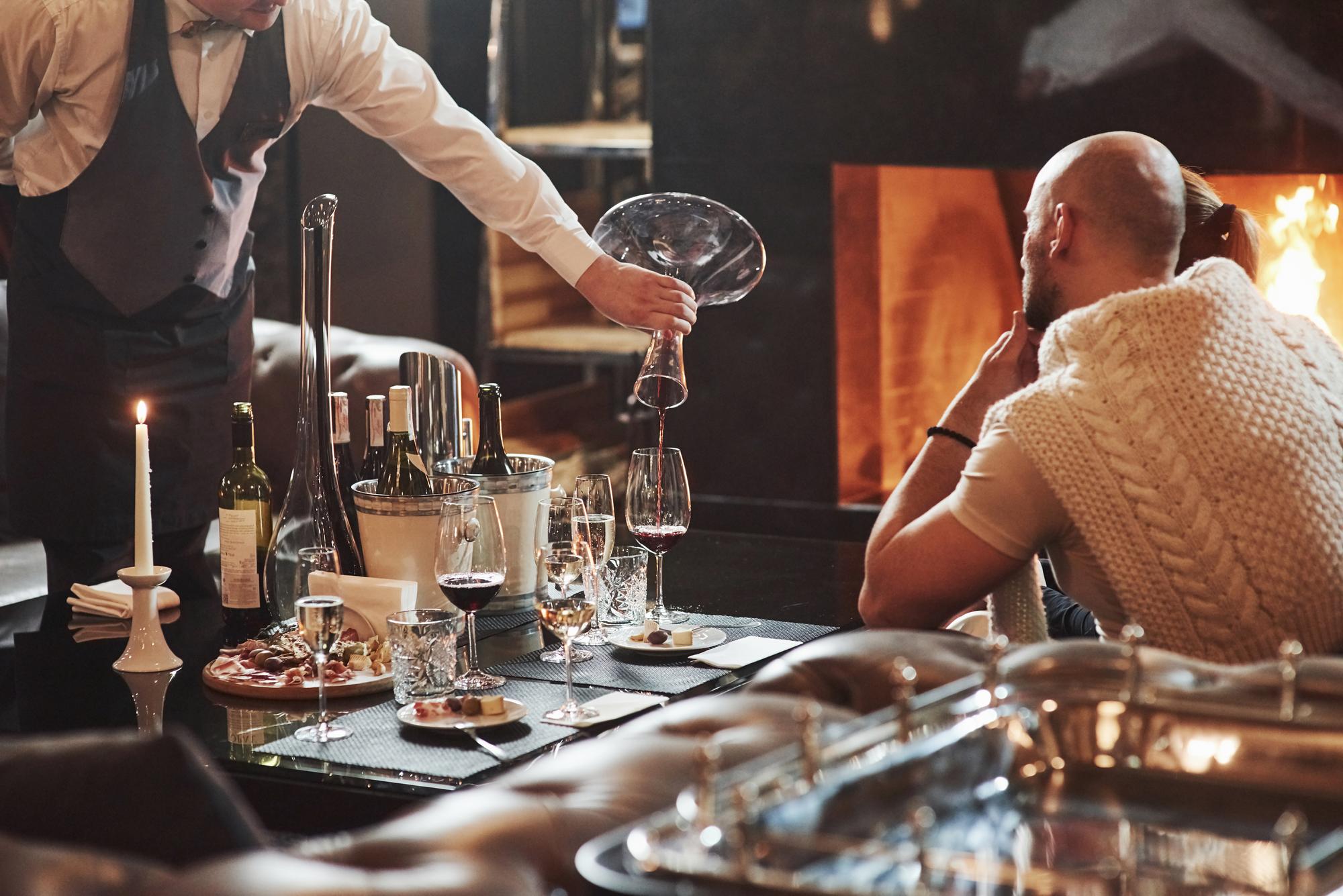 Chef and small team setting a dining table